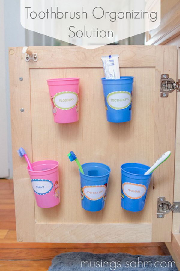 Install These Cups Behind The Cabinet Door To Organize Your Toothbrushes 