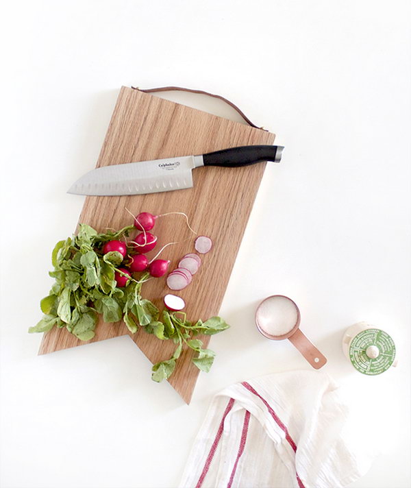  Leather Handled Cutting Board.  The leather handle adds an extra dash of classiness to your cutting board and will definitely come in handy when you're moving around the kitchen or if you want to hang it to display your mad woodworking skills. Get the tutorial  