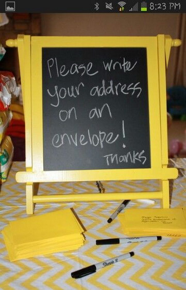 Blackboard And Blank Envelopes For Guests Writing Their Names And Addresses. 