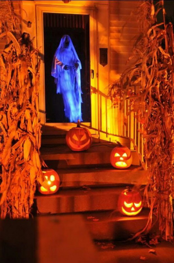 Spooky Door Greeter. What a fun Halloween chicken wire ghost dressed in cheesecloth! 