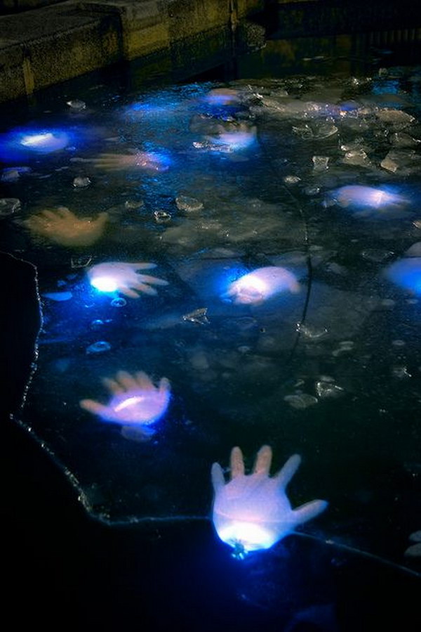 What a creepy idea for Halloween decor! Latex gloves with glow sticks in your pond for Halloween!