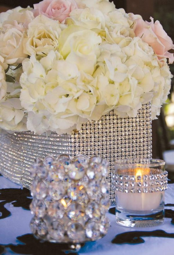 Diamond Mesh Wrapped Centerpieces. Buy rhinestones, glue them with a hot glue gun or gorilla glue and voila! 