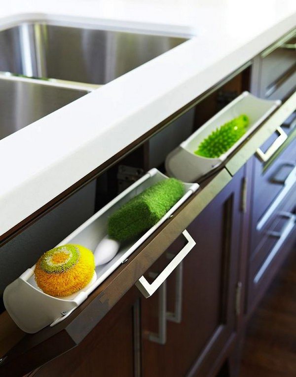 Use Hidden Pull Out Panel Below Kitchen Sink to Store Sponges and Accessories. 