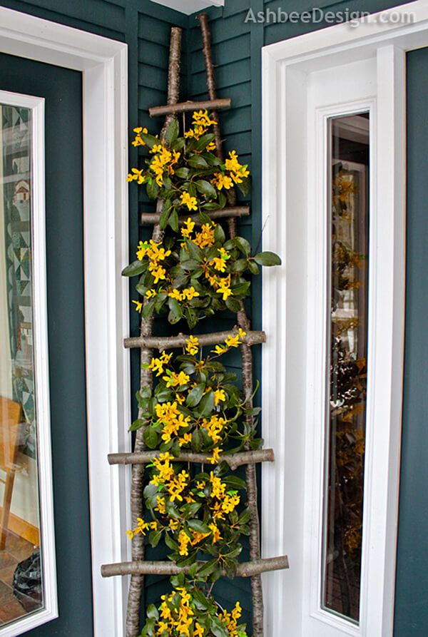 DIY Branch Ladder Flower Display. 